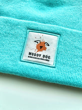 Load image into Gallery viewer, Battersea Muddy Dog Beanie, Muddy Dog, muddy dog merchandise, Battersea Branded, Battersea merchandise, muddy dog challenge, muddy dog event, beanie, blue beanie,