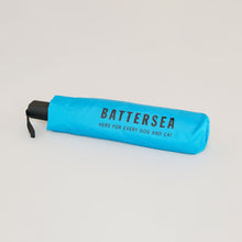 Load image into Gallery viewer, Battersea Wear Blue for Rescue Umbrella, WBFR umbrella, Battersea umbrella, blue umbrella, Wear Blue for Rescue, Battersea, WBFR, Battersea branded, Battersea merchandise, Supporting Rescue, Rescue is my favourite breed, wearblueforrescue,